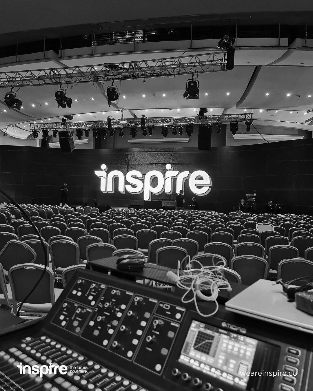 Atmospheric stage lights and audience silhouettes